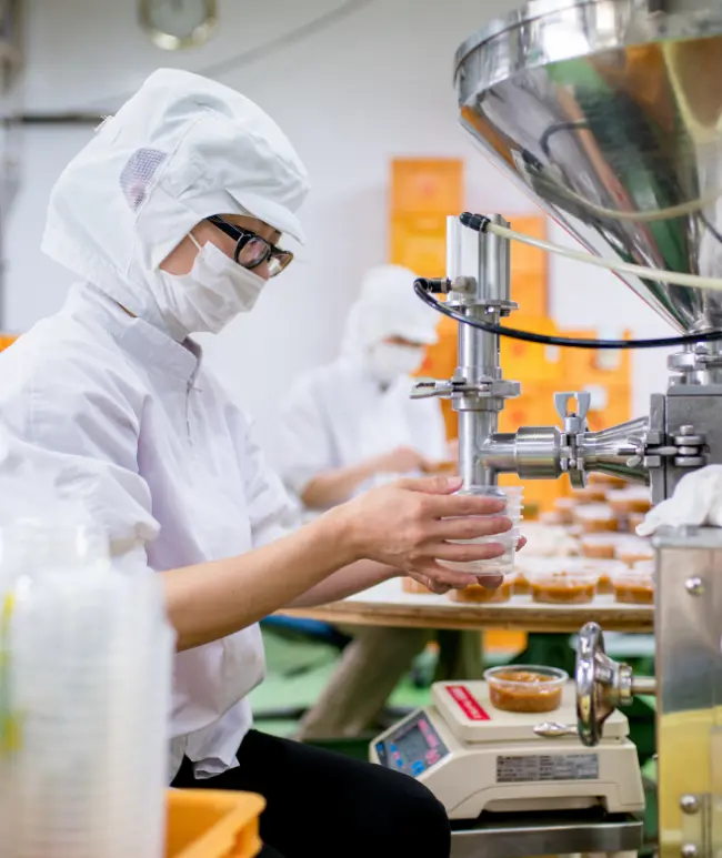 Food-processing line staffed by PHCDC manpower in Malaysia