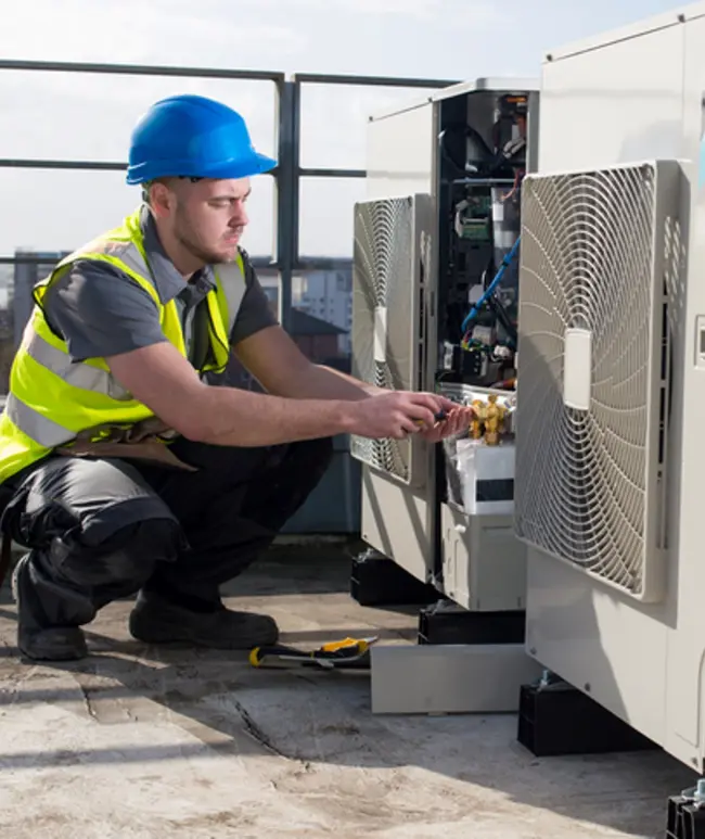 PHCDC technicians installing M&E and HVAC systems on site